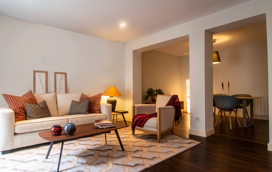 A warm, dry living room with soft lamplight — a healthy, comfortable home.
